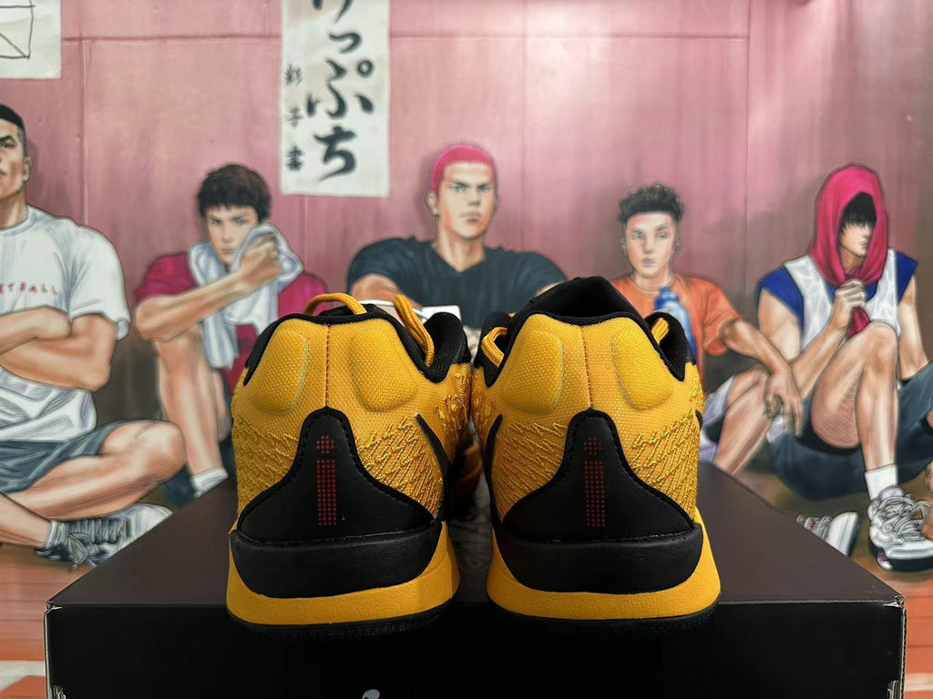 Rear view of black and yellow Nike basketball shoes
