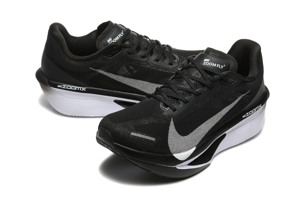 Pair of black Nike Zoom Fly 6 shoes with light-colored swooshes and white midsole sections