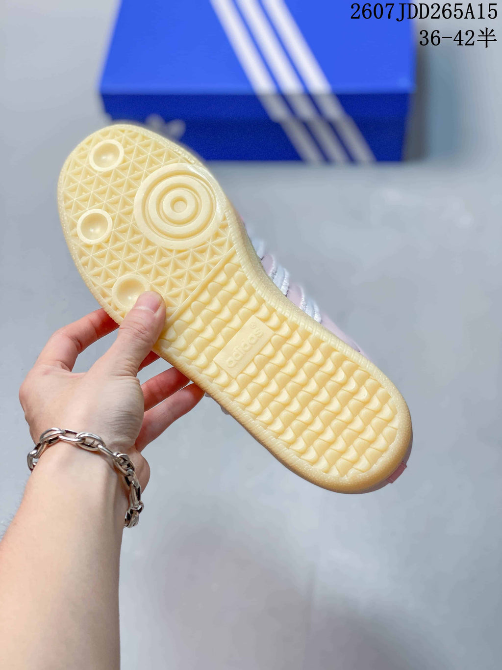 Close-up of the textured gum-colored outsole with circular and geometric tread details.