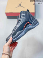 Side profile of the dark high-top sneaker showing the red-accented side detail, layered upper, and sculpted outsole.