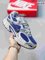 White and blue Nike V5 RNR sneaker with blue mesh panels, blue accents and a white sculpted sole.