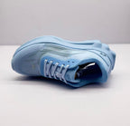 Single light blue sneaker displayed on its side, showing the upper and padded opening.