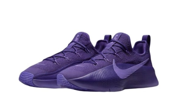 Pair of purple low-top lace-up sneakers shown against a white background.