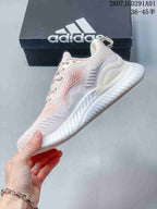 Side view of the low-top sneakers with pale pink accents