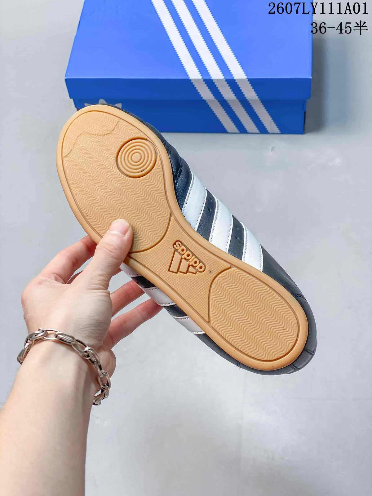 Underside of the sneaker showing a gum-colored outsole with textured tread