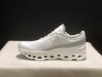 Side profile showing the white upper, padded collar, and sculpted sole.