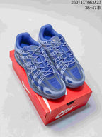 Pair of blue and gray Nike P-6000 sneakers displayed on a red shoebox