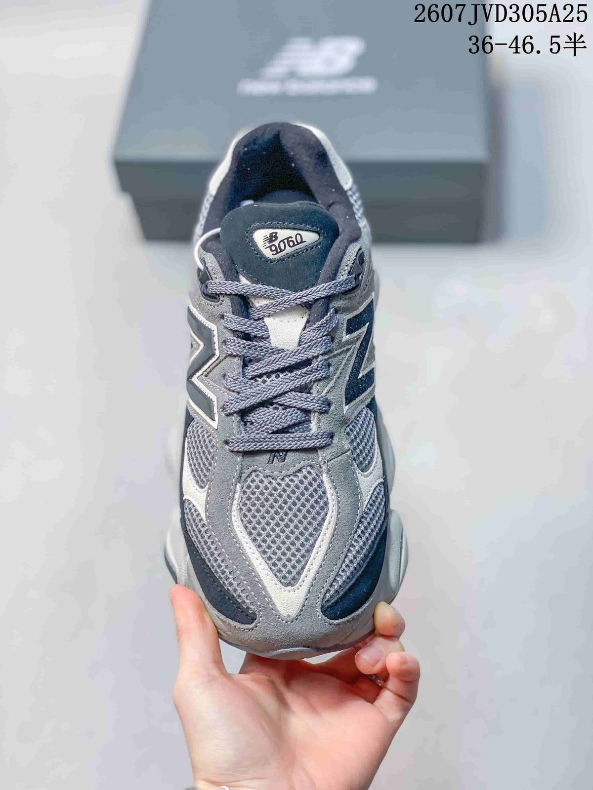 Front view showing the mesh toe box, grey overlays, navy accents, and laces.