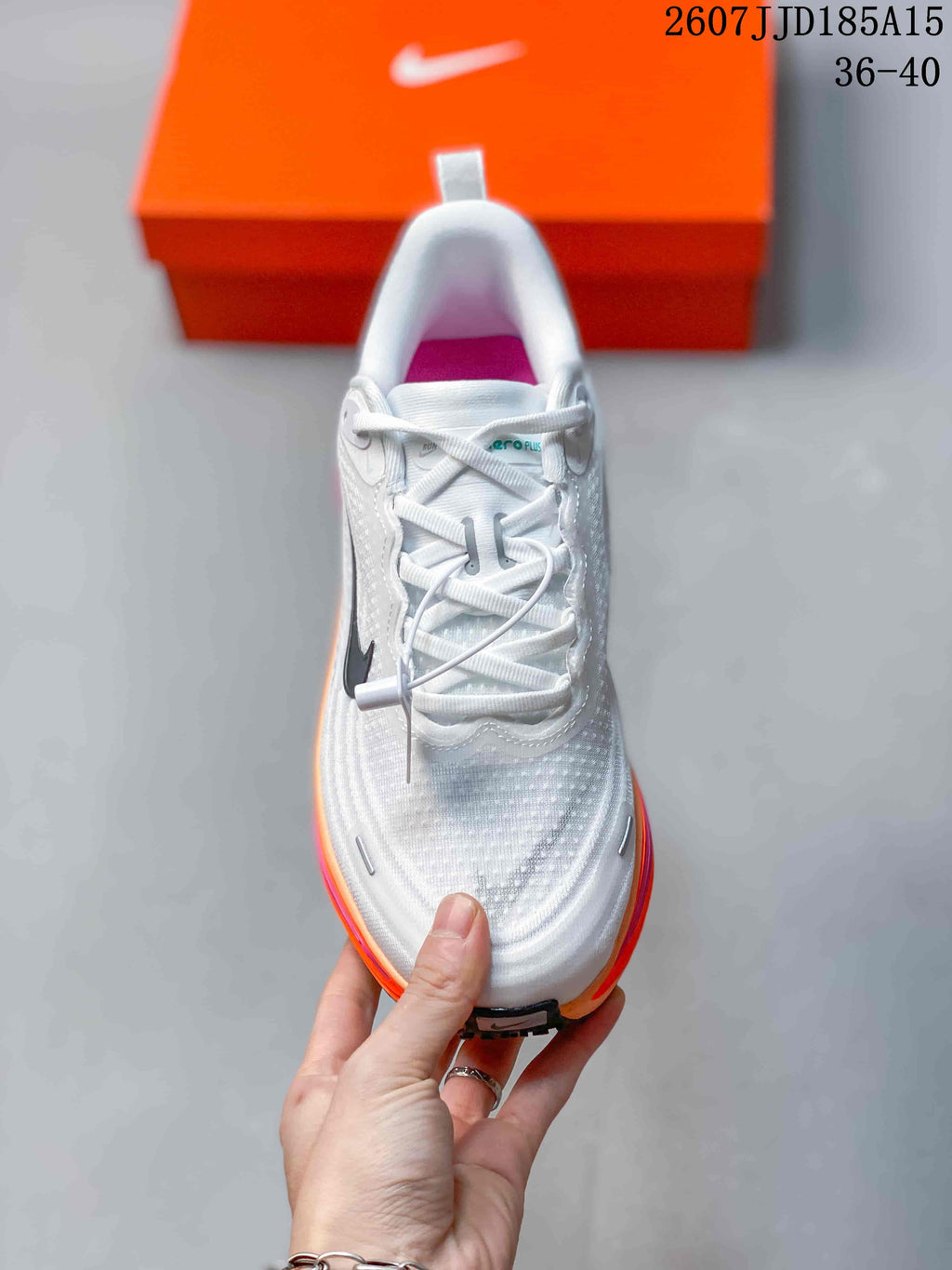 Top view showing the white lace-up construction, padded collar, and textured toe area.