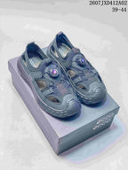 Pair of dark gray ECCO closed-toe sandals with dial-style closures, photographed on a shoebox.