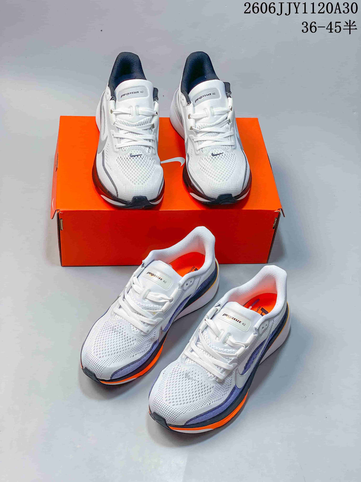 Two views of white Pegasus 42 running shoes with dark and orange accents.