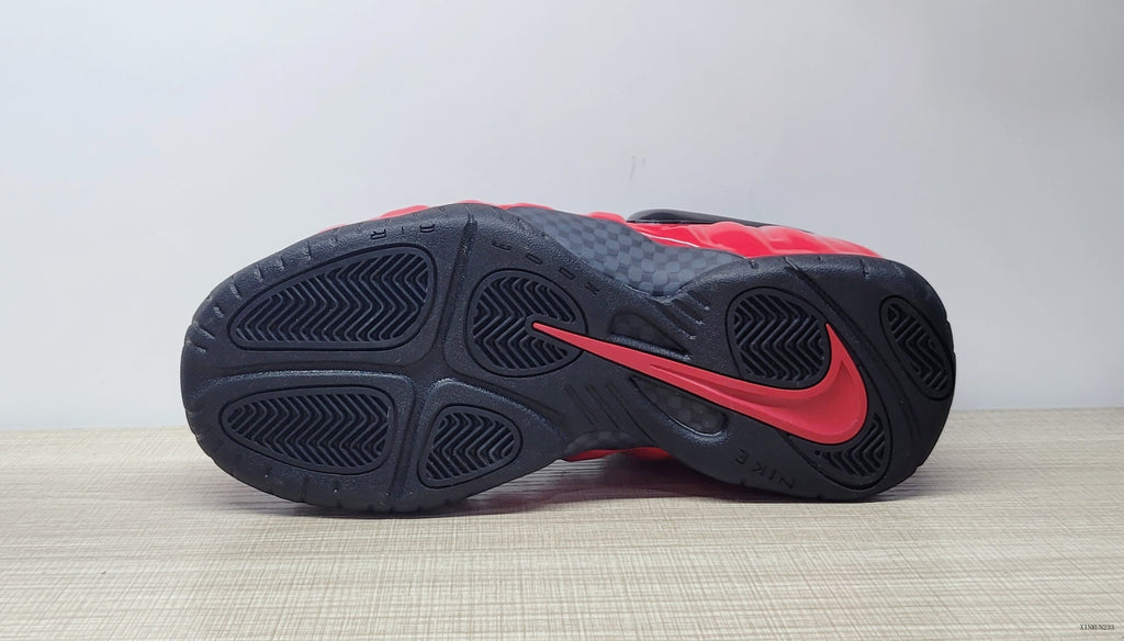 Underside view showing the black outsole and red accent