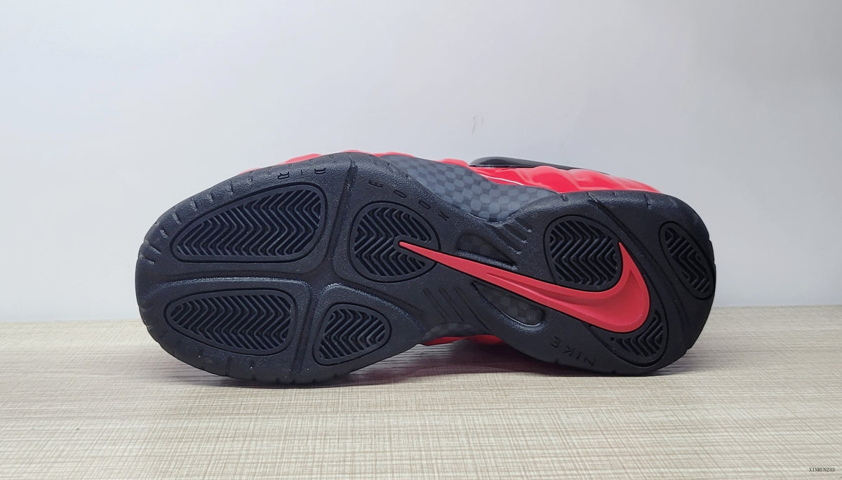 Underside view showing the black outsole and red accent