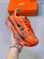Three-quarter side view highlighting the orange upper, black Swoosh and layered midsole.