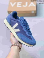 Blue VEJA Rio Branco sneaker with a light V logo, textured panels and cream-colored midsole.