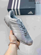 Silver adidas Ghost Sprint sneaker shown close up with reflective-looking panels and a light outsole.