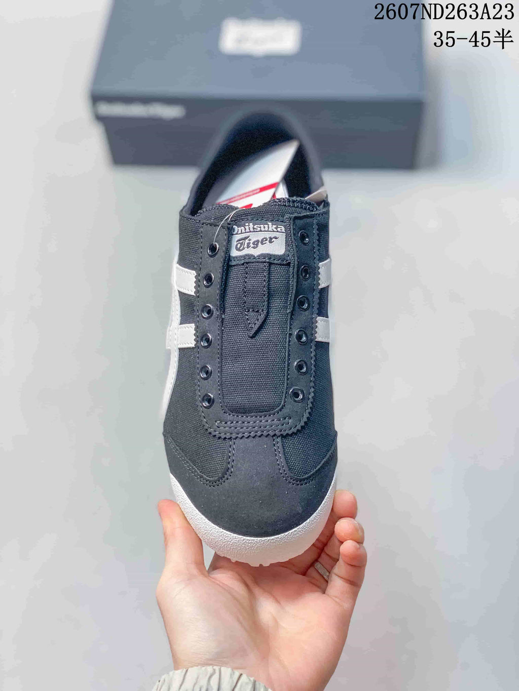 Top view of the sneaker showing the black upper, front detailing and Onitsuka Tiger tongue label.