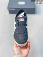 Top view of the sneaker showing the black upper, front detailing and Onitsuka Tiger tongue label.