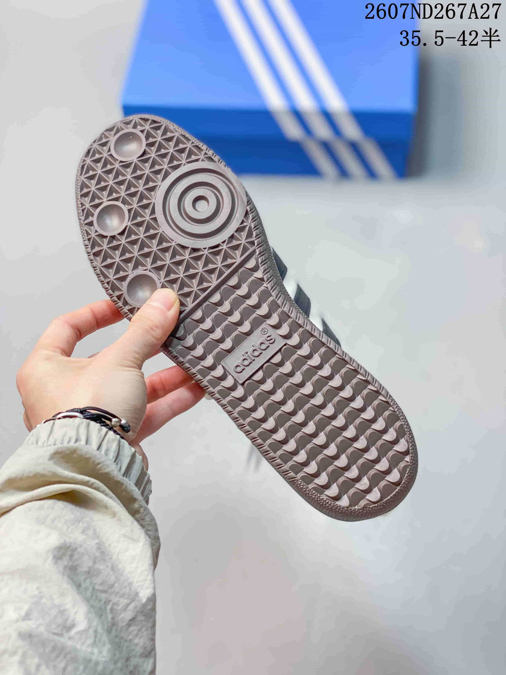 Close-up of the textured gum-colored outsole with circular and geometric tread details.