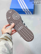 Close-up of the textured gum-colored outsole with circular and geometric tread details.