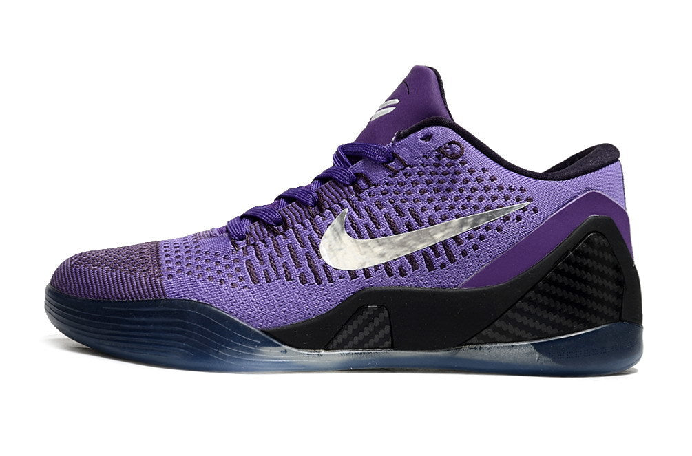 Side view of a purple and black low-top shoe.