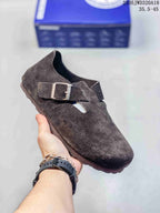Dark brown closed-toe sandal with two buckle straps; size range text appears in the image.