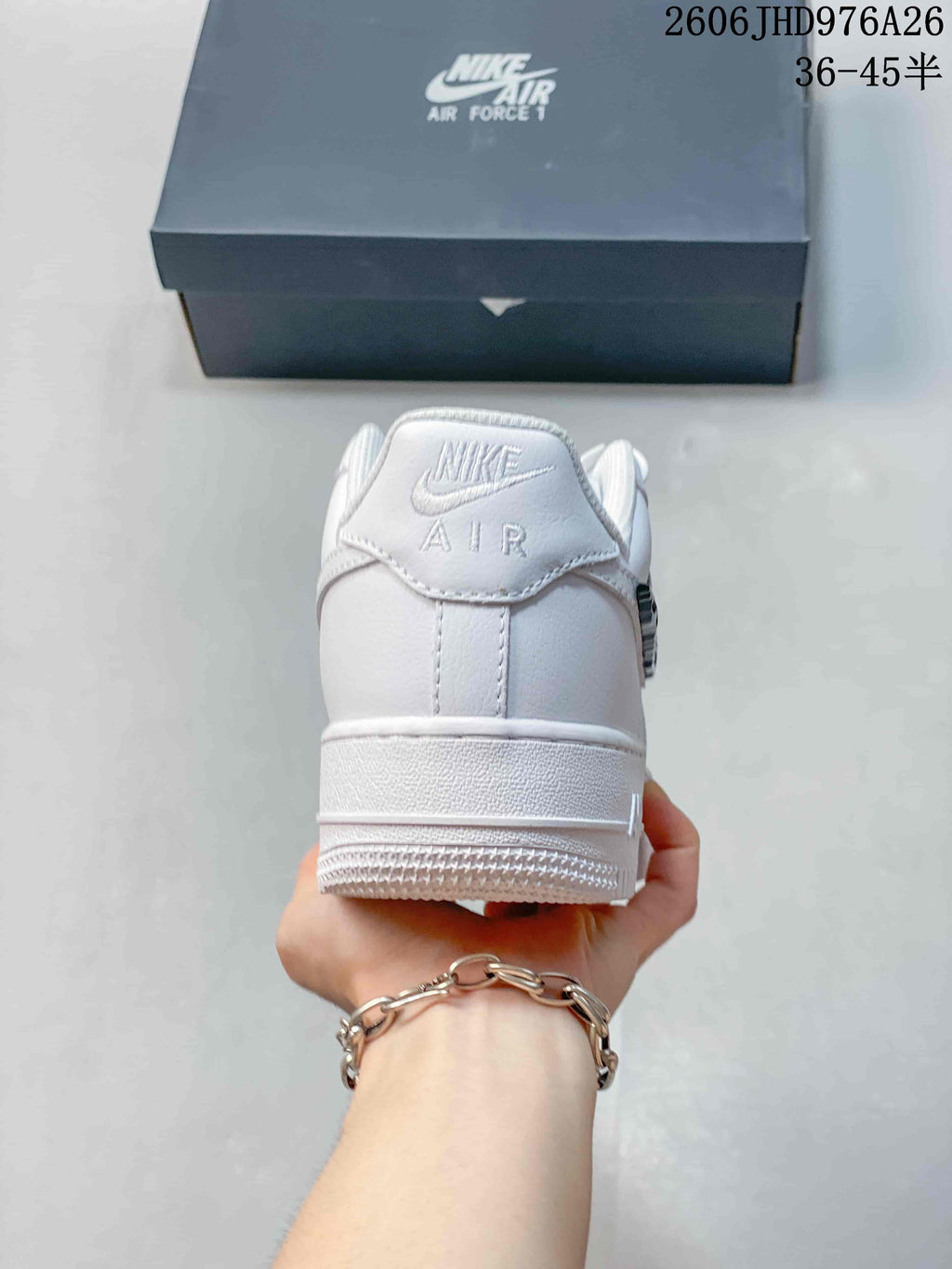 Rear view of a white low-top sneaker with Nike Air branding on the heel.