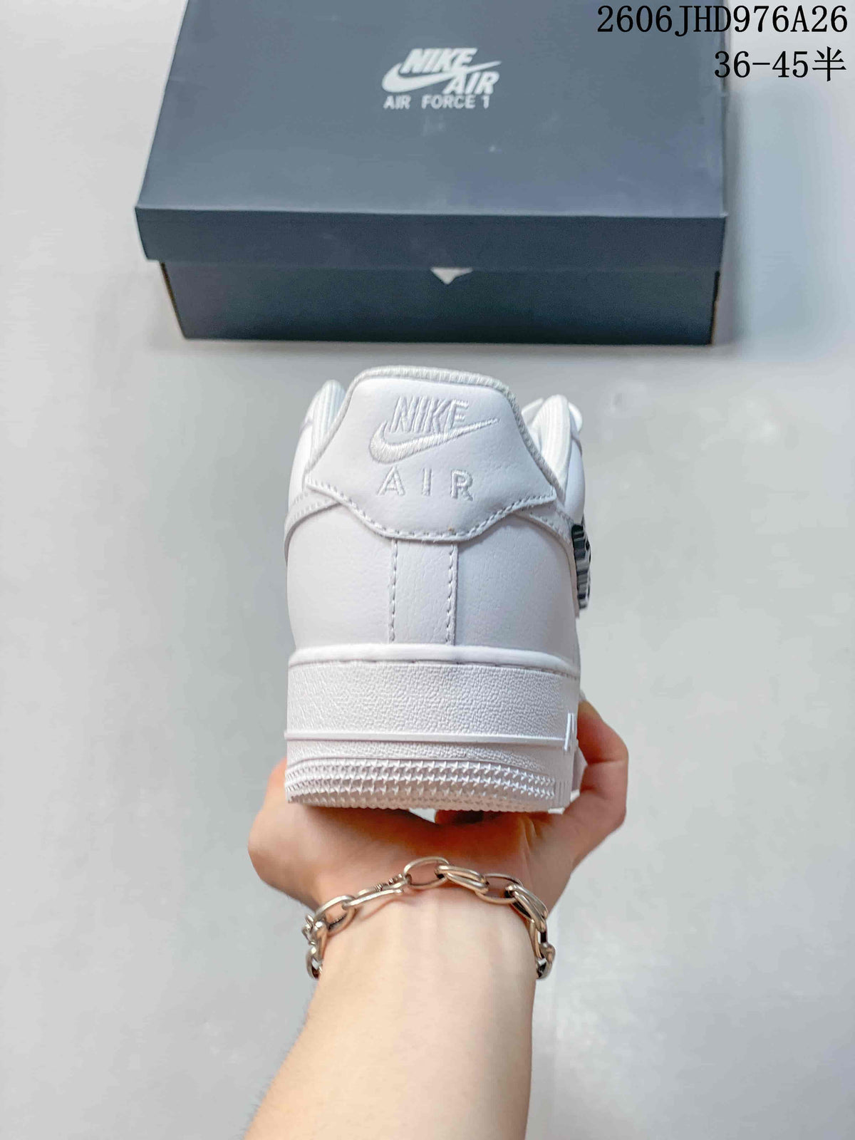 Rear view of a white low-top sneaker with Nike Air branding on the heel.
