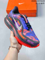 Side view of the blue, purple, and orange running shoe with a contrasting outsole