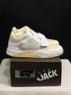 Pair of white and cream Jordan Jumpman Jack sneakers displayed on a black shoebox, with the box label visible.