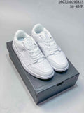Pair of white Jordan Air Jordan 1 Low sneakers displayed on a black shoe box; style code and size range text appear at the top.