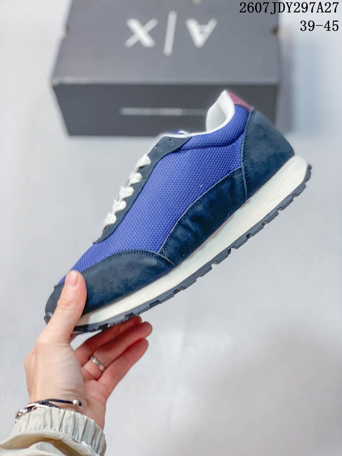 Side profile showing the blue textured upper, burgundy detailing, cream midsole, and lugged outsole.