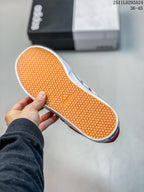 Close view of the sneaker outsole showing a gum-colored textured tread and adidas branding.