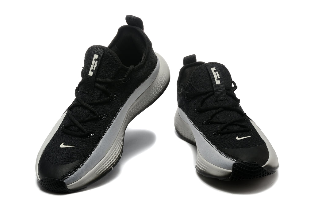 Pair of black and white low-top Nike LeBron training shoes shown from the front and side.