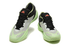 Pair of pale gray Adidas Adizero shoes with light green soles and coral tongue logos