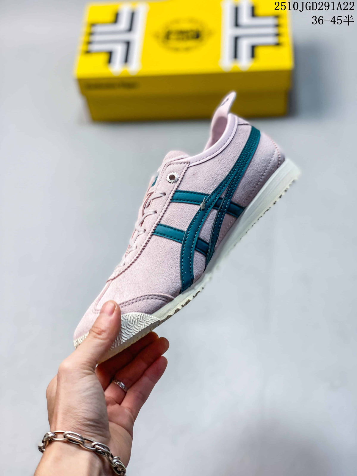 Side view of a pink Onitsuka Tiger sneaker with teal stripes, lace-up fastening and a light cream outsole.