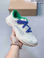 Close side view of a white On Cloudnova Moon sneaker with blue straps and a green padded collar.