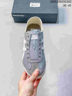 Top view showing the lace-free front, gray panels, and branded tongue area.