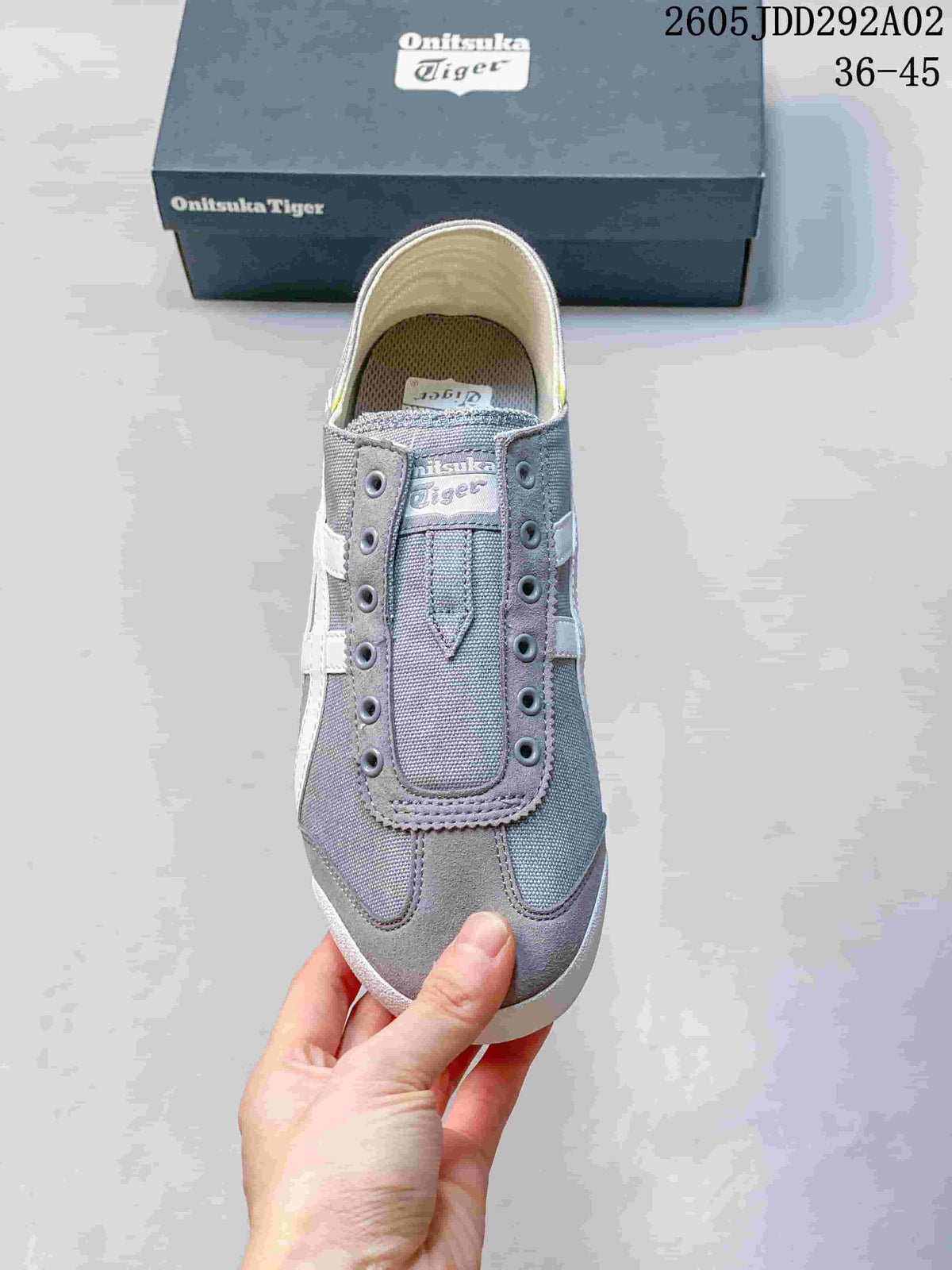 Top view showing the lace-free front, gray panels, and branded tongue area.