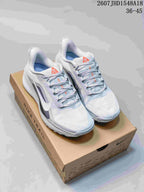 Pair of white and gray Nike low-top sneakers displayed on a shoebox, with the source size range 36–45 visible above.