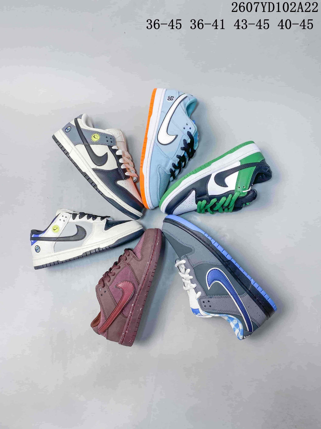 Group view showing six Nike SB Dunk Low Pro colorways and the size-range labels displayed above them.