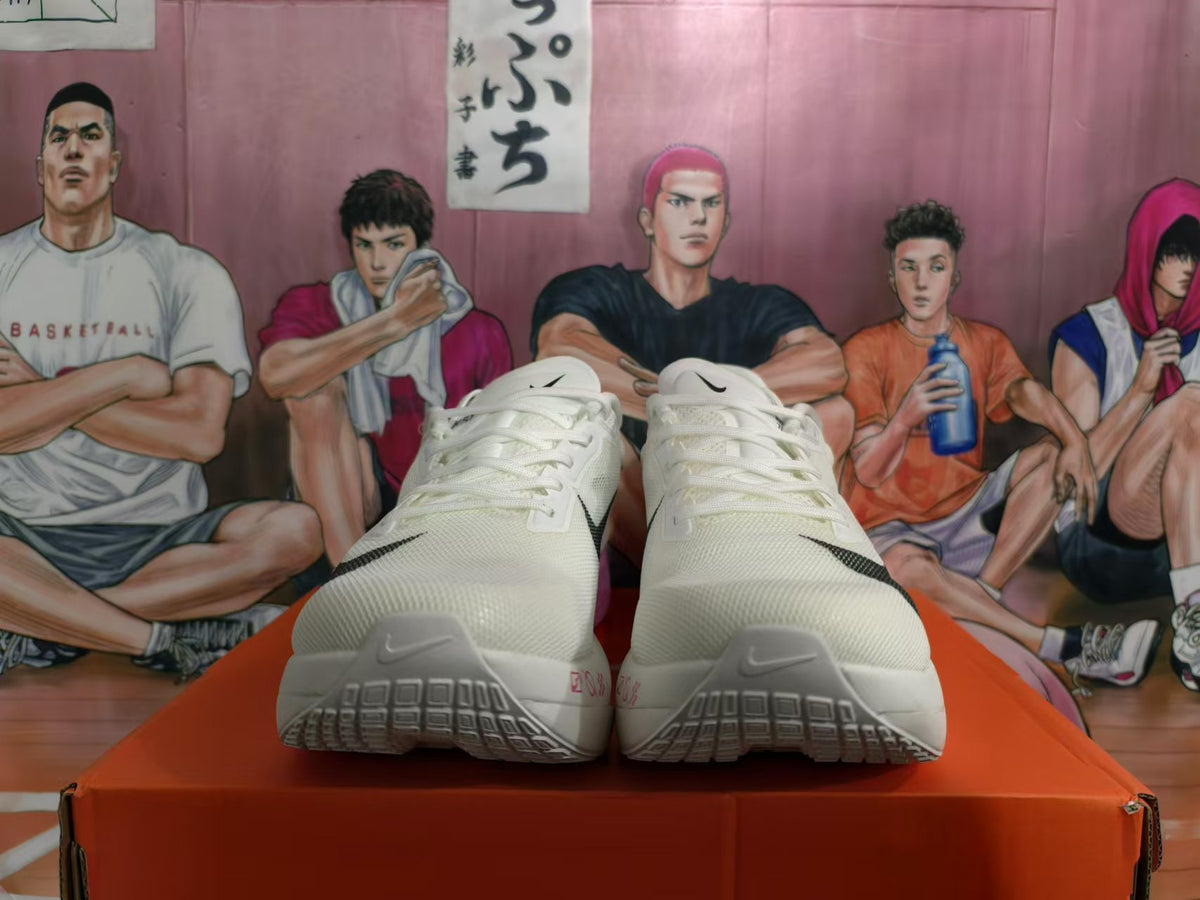 Front view of white lace-up Nike running shoes
