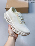 Angled side view showing the white upper, On branding and sculpted sole
