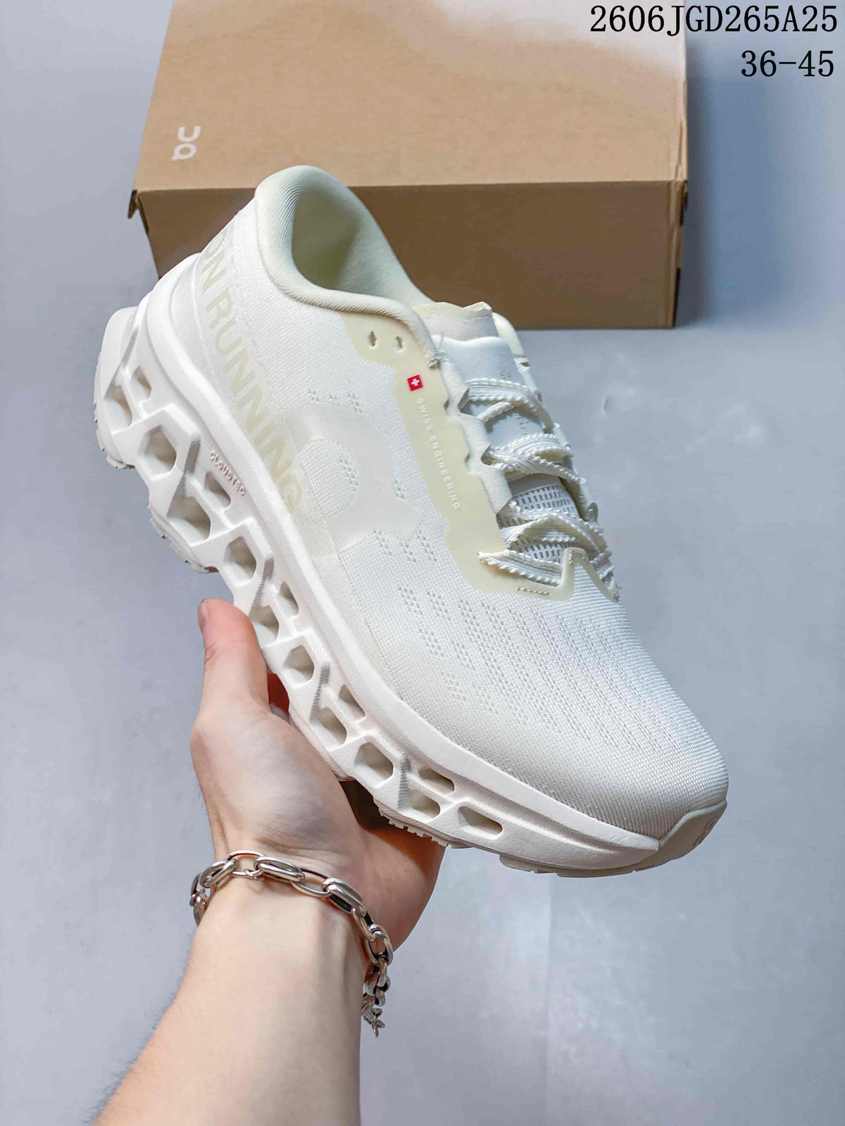 Angled side view showing the white upper, On branding and sculpted sole