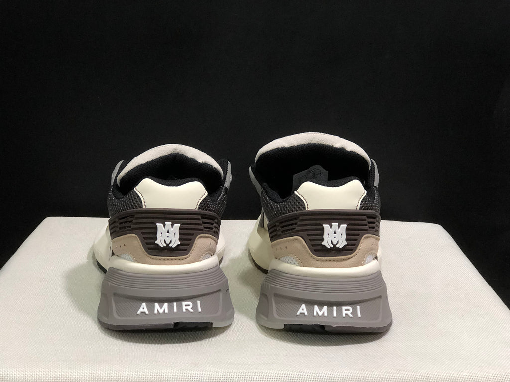 Rear view showing AMIRI branding on the heel panels and outsole.