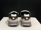 Rear view showing AMIRI branding on the heel panels and outsole.
