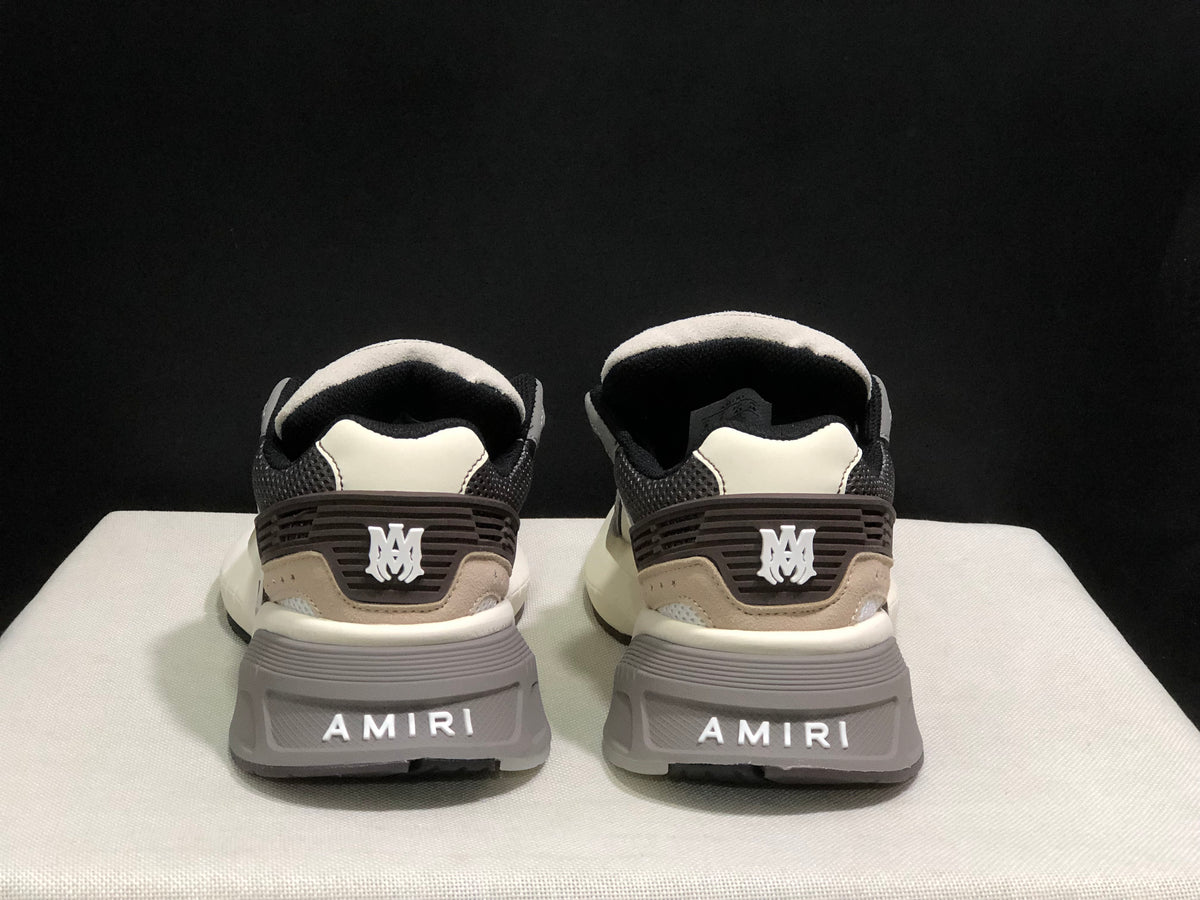 Rear view showing AMIRI branding on the heel panels and outsole.