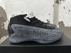 Side view showing the black upper and honeycomb-textured dark gray panel.
