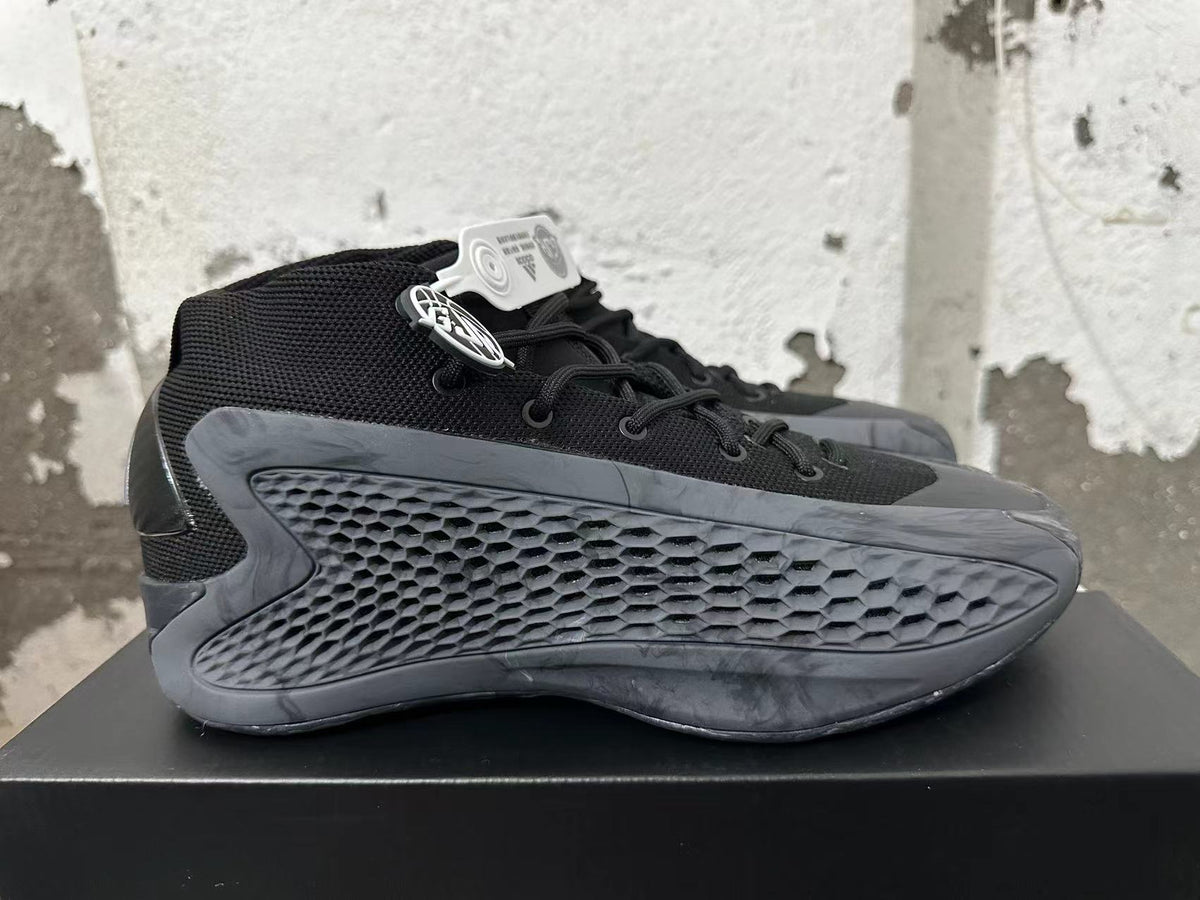 Side view showing the black upper and honeycomb-textured dark gray panel.