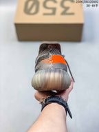 Rear view showing the grey knit-style heel and translucent rounded outsole.